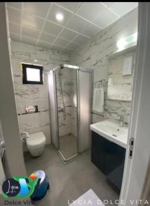 a bathroom with a shower and a toilet and a sink at LYCIA DOLCE ViTA OLYMPOS ANTALYA in Kumluca