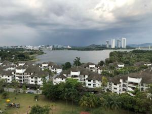a city with houses and a river and buildings at Casa Blanca R2 in Cyberjaya
