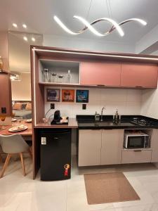 a kitchen with a sink and a counter top at Studio Sunset João Pessoa in João Pessoa