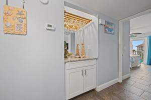 a kitchen with a counter and a sink in a room at Pelicans Watch 218 in Myrtle Beach