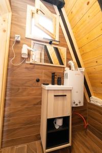 a small kitchen in a tiny house at Eka's Village in Plav +171 photos