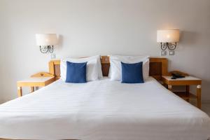 Posteľ alebo postele v izbe v ubytovaní Hotel Calypso