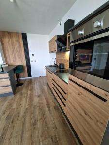 Kuchyň nebo kuchyňský kout v ubytování Apartament near RedBull Ring