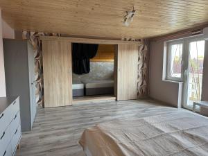 Postel nebo postele na pokoji v ubytování Greta ház + 23 fotografií