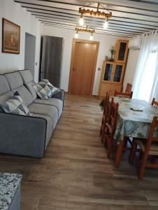 a living room with a couch and a table at Casa Soro Ayna in Ayna +32 photos