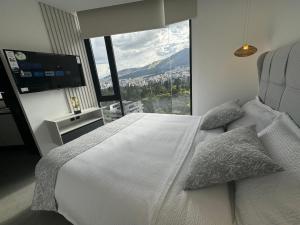 Ένα ή περισσότερα κρεβάτια σε δωμάτιο στο Nuevo Studio- Piso 17 Vista La Carolina - Edificio Harmony +43 φωτογραφίες