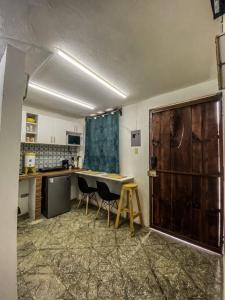 a kitchen with a table and chairs in a room at Casa San Bartolo in Antigua Guatemala