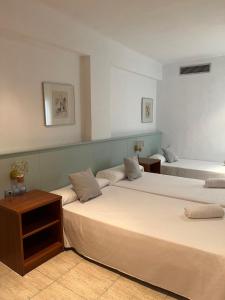 Postel nebo postele na pokoji v ubytování Fleming Center by Punta 25 Hotels Group