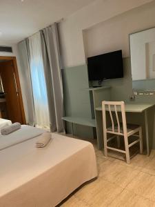 TV a/nebo společenská místnost v ubytování Fleming Center by Punta 25 Hotels Group