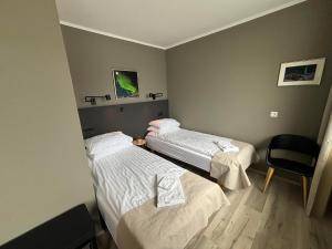 Tempat tidur dalam kamar di Klara Guesthouse
