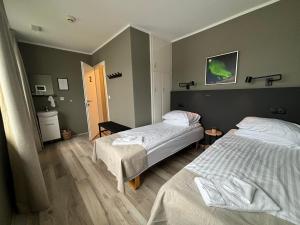 Tempat tidur dalam kamar di Klara Guesthouse