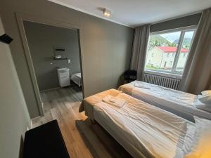 Tempat tidur dalam kamar di Klara Guesthouse