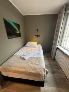 Tempat tidur dalam kamar di Klara Guesthouse