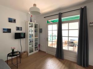 a living room with a sliding glass door at Casita MATILDA Puerto del Carmen in Puerto del Carmen