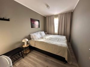 Tempat tidur dalam kamar di Klara Guesthouse