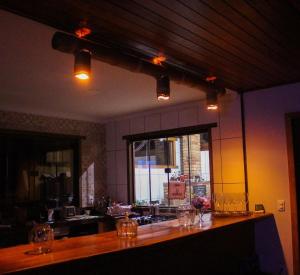 a kitchen with a counter with glasses on it at Recanto Aldeia in PatrimÃ´nio da Penha