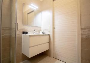 a bathroom with a sink and a shower at Athena Rooms - Parcheggio privato in Bologna +54 photos