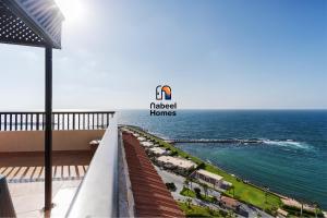 a view of the ocean from the balcony of a hotel at Nabeel Homes - Penthouse Duplex with Rooftop in Alexandria