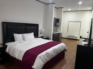 Postel nebo postele na pokoji v ubytování Hotel Los Arcos