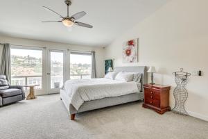 a bedroom with a bed and a ceiling fan at San Marcos Getaway with Deck and Lake Views! in San Marcos