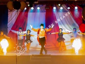 a group of people dancing on a stage at Driftwood - Bronze 3 bedroom West Sands Sleeps 8 in Selsey +23 photos
