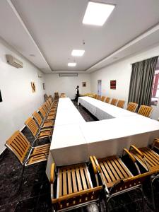 a conference room with a long table and chairs at Le relais des sables in Tatta +61 photos