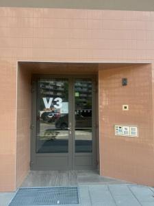 a front door of a building with a sign on it at 4U centre apartments in Olomouc