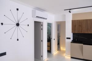 a kitchen with a large clock on the wall at Apartment PREMIUM CALPE in Ifach