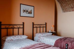 A bed or beds in a room at Sky & Vineyards - Melograno -