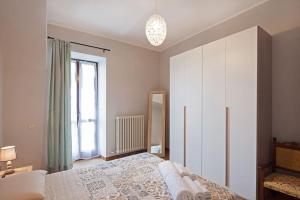 A bed or beds in a room at Sky & Vineyards - Melograno -