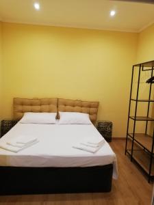 Postel nebo postele na pokoji v ubytování Candelieri Suites