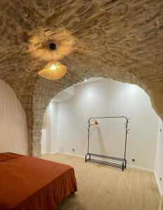 Ένα ή περισσότερα κρεβάτια σε δωμάτιο στο Maison de Village