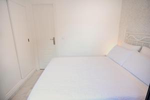 A bed or beds in a room at Macarena Home