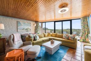 a living room with a couch and a table at Mayan Princess 101 in Port Aransas