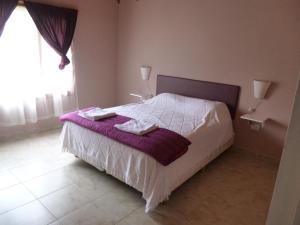 Ένα ή περισσότερα κρεβάτια σε δωμάτιο στο La Pausa