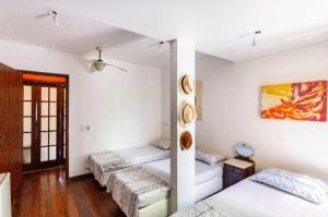 Ένα ή περισσότερα κρεβάτια σε δωμάτιο στο Hostel Espaço Grajaú