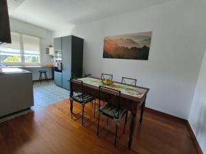 a kitchen with a table and chairs in a room at Locazione Lilibet in Conegliano