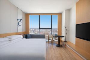 Postel nebo postele na pokoji v ubytování Fairfield by Marriott Shijiazhuang High-Tech Zone