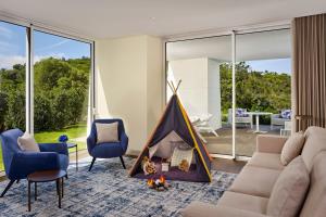 a living room with a couch and a tent at Penha Longa Resort in Sintra