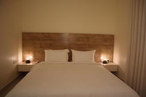 Postel nebo postele na pokoji v ubytování Zaan Apartment Al-Nafel