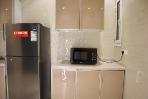 Kuchyň nebo kuchyňský kout v ubytování Zaan Apartment Al-Nafel + 49 fotografií