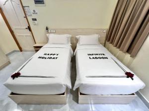Letto o letti in una camera di INFINITE LAGOON