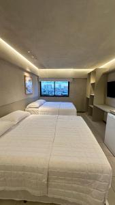 Postel nebo postele na pokoji v ubytování Loft 1 Edf celita Franca Business hotel