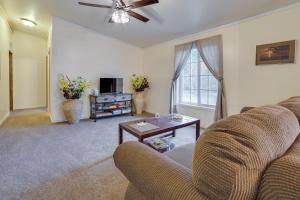 a living room with a couch and a table at Spacious De Tour Village Home Near Lake Huron! in De Tour Village