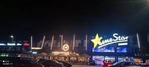 a store with a star on the front of it at night at Hidden Dream Place Sarajevo in Sarajevo