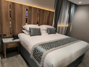 Voodi või voodid majutusasutuse فندق نسمات مكةNasamat Makkah Hotel toas