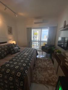 Ένα ή περισσότερα κρεβάτια σε δωμάτιο στο Flat Beira Mar Piedade 1603