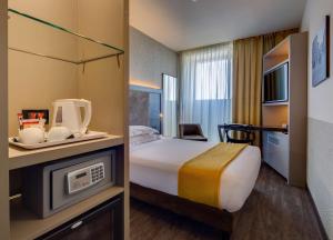 A bed or beds in a room at Best Western Plus Hotel Farnese