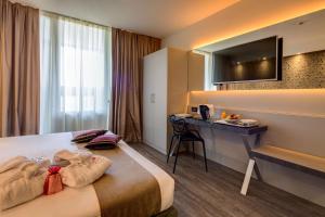 A bed or beds in a room at Best Western Plus Hotel Farnese
