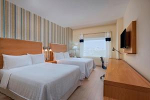 Voodi või voodid majutusasutuse Four Points by Sheraton Cancun Centro toas